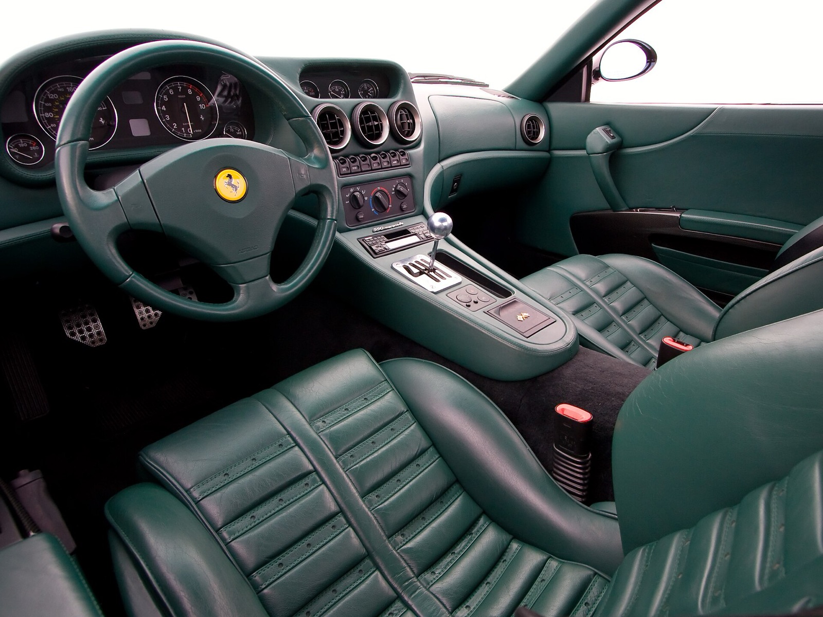 Ferrari 550 Maranello cockpit in green leather with the polished gated six-speed shifter