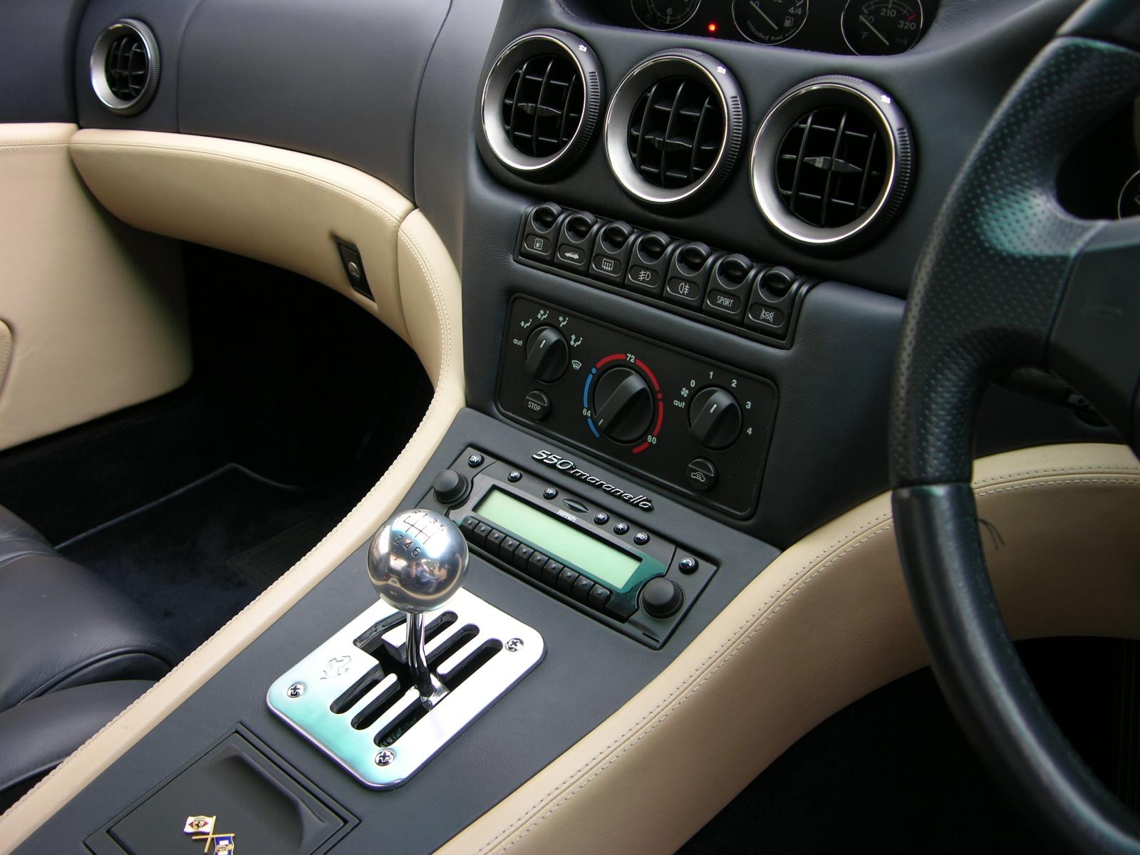 Ferrari 550 Maranello center console showing the switch bank, climate controls, and gated shifter