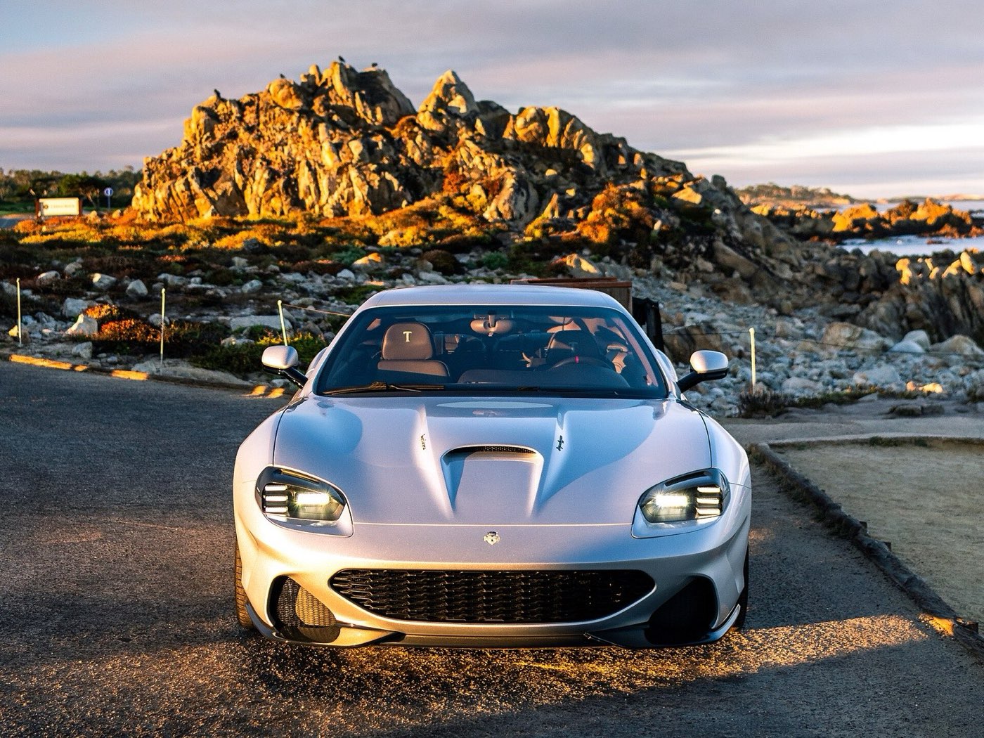 Touring Superleggera Veloce12 in silver, head-on, parked at golden hour