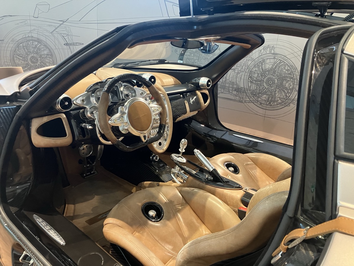 Pagani Huayra interior — analogue gauges, machined aluminium, aerospace fasteners safety-wired throughout