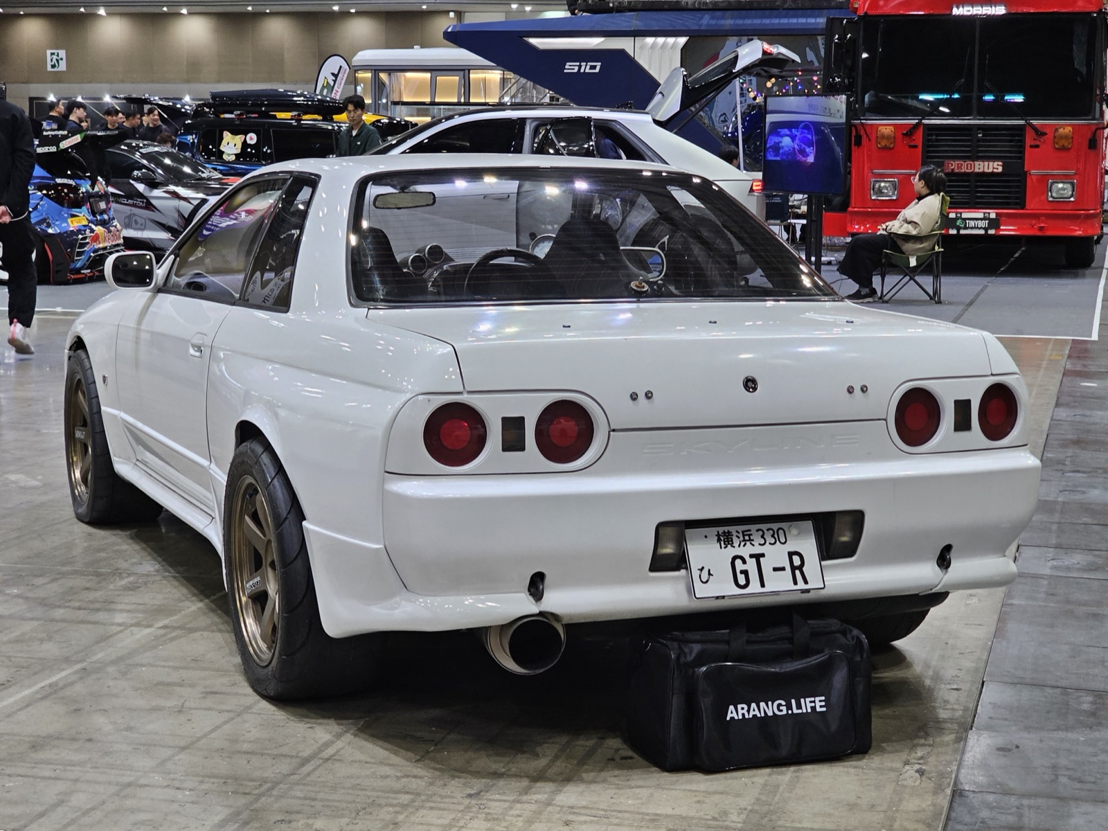 Nissan Skyline R32 GT-R in Bayside Blue showing aggressive front fascia