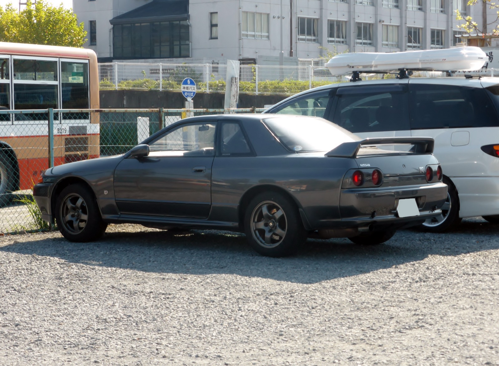 Nissan Skyline R32 GT-R rear three-quarter showing the signature round tail lights