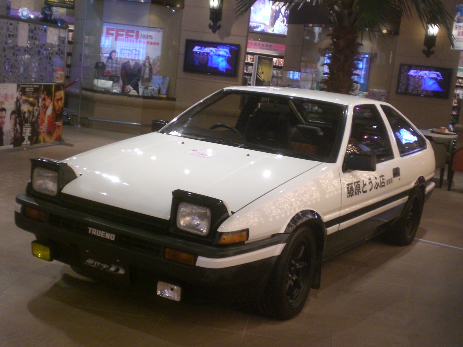 Toyota Sprinter Trueno AE86 with iconic pop-up headlights raised